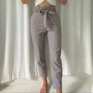 High-waisted navy blue and tan plaid pants